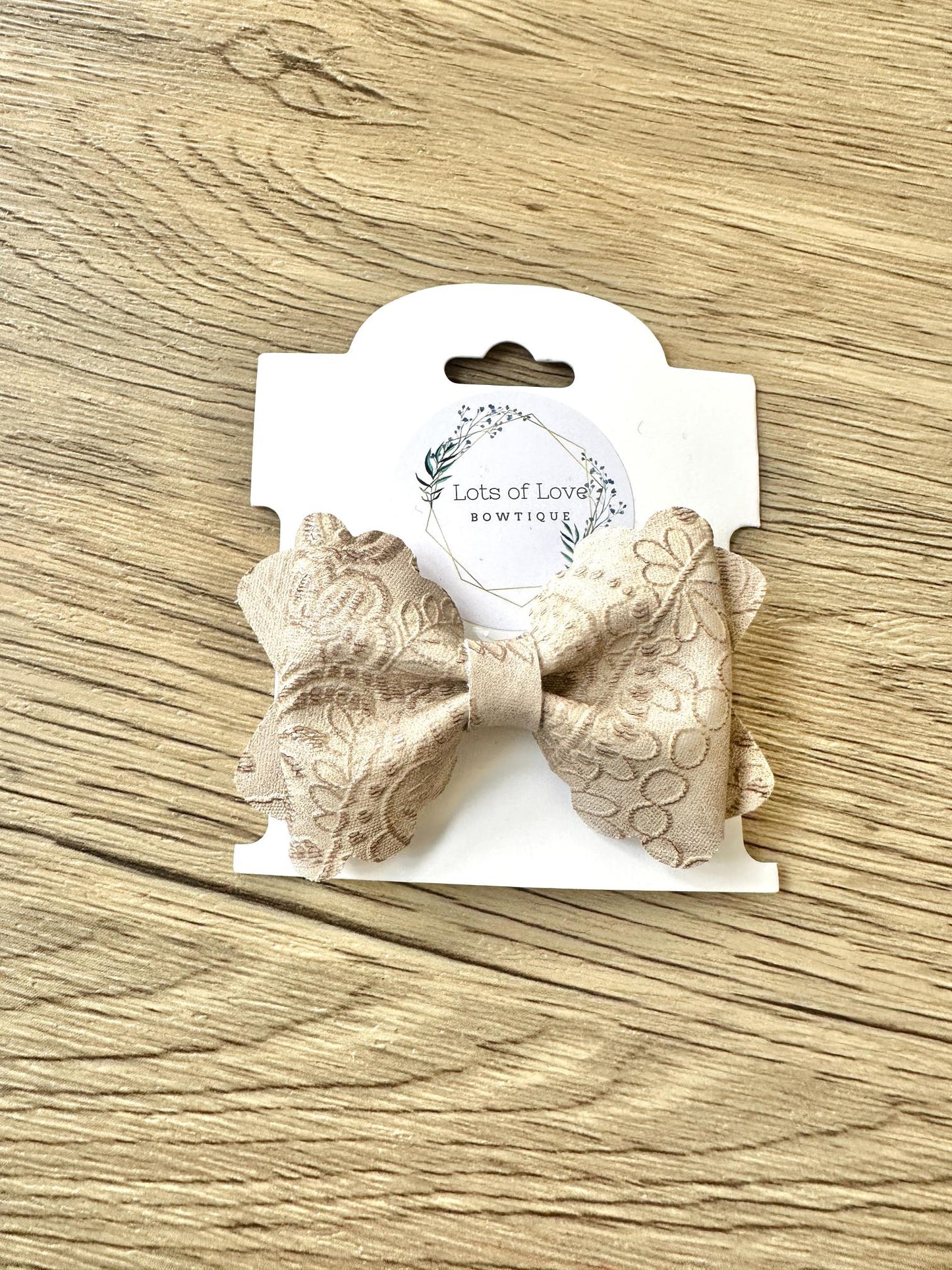 Tan Embossed Grace Bow